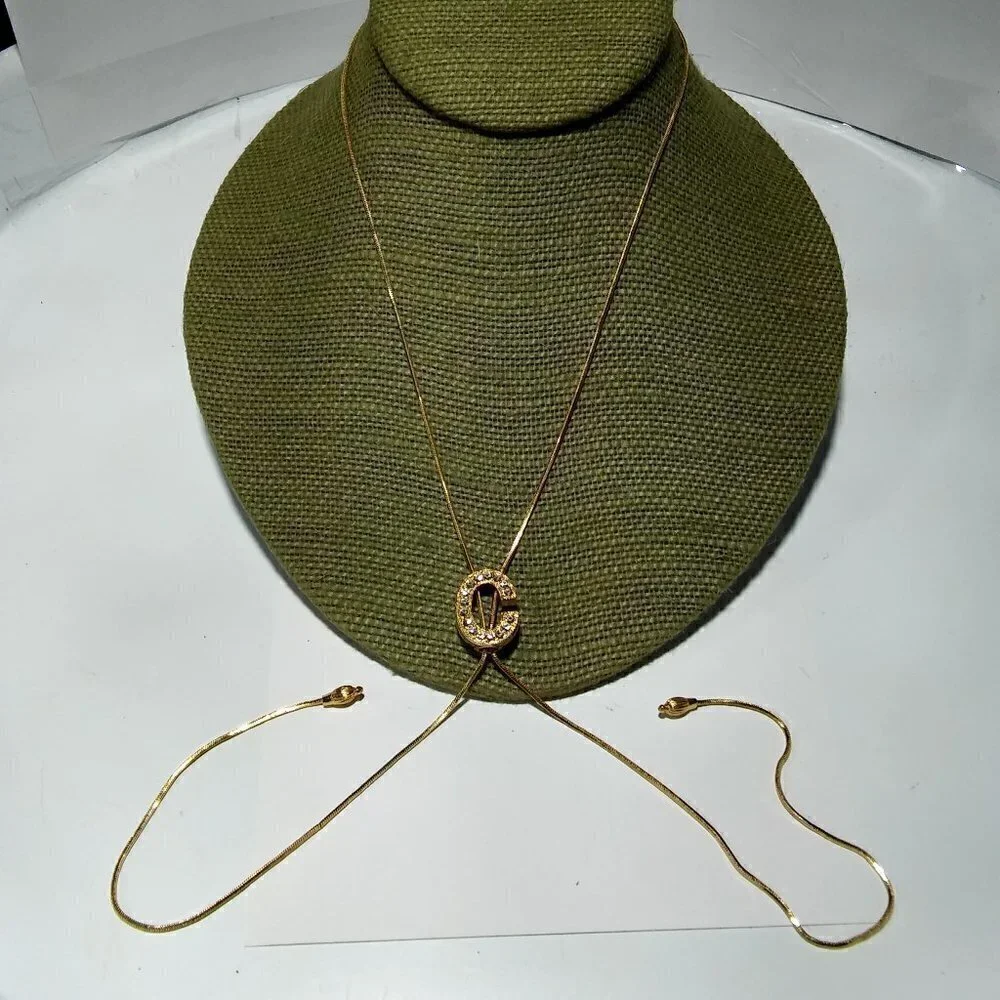 Women`s gold tone initial C lariat crystal neckl.